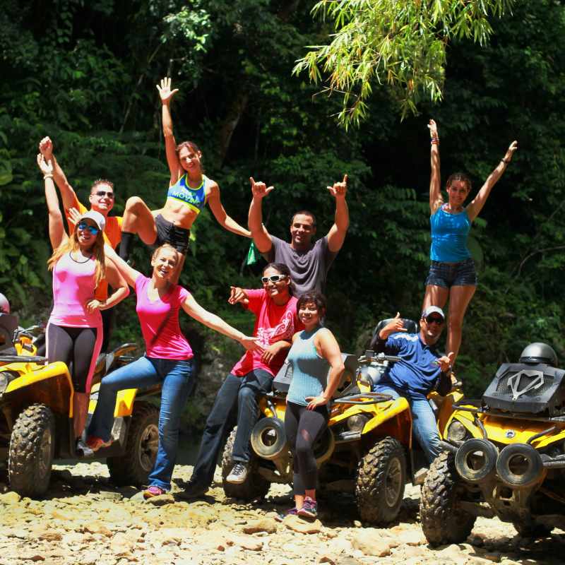 Group of people standing with their ATVs