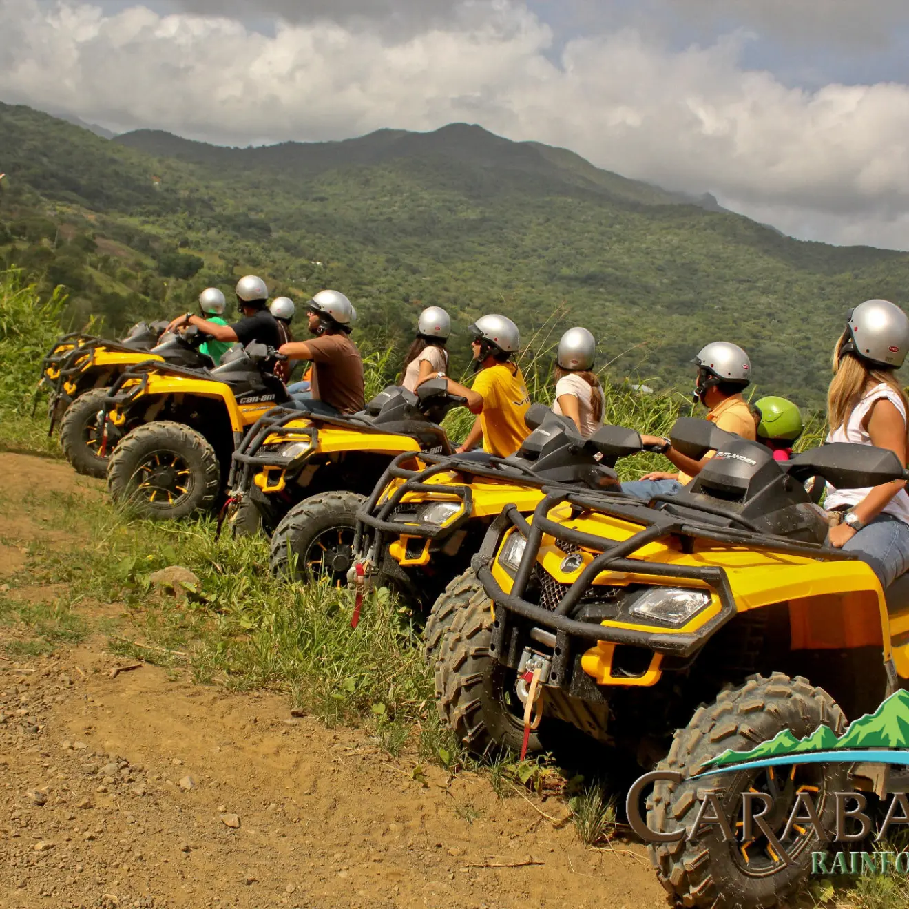 Group of people are yellow ATVs