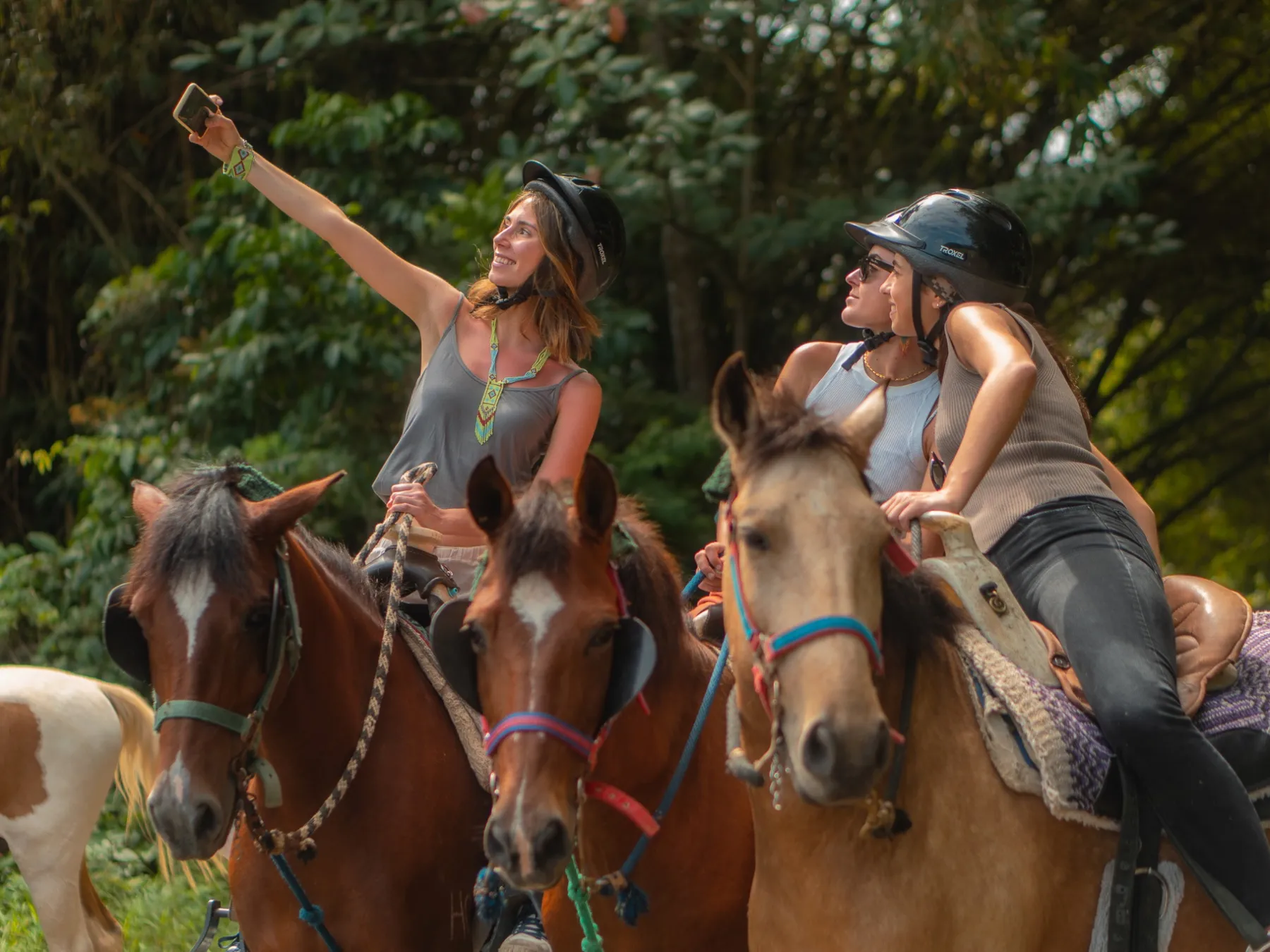 a couple of people that are sitting on a horse