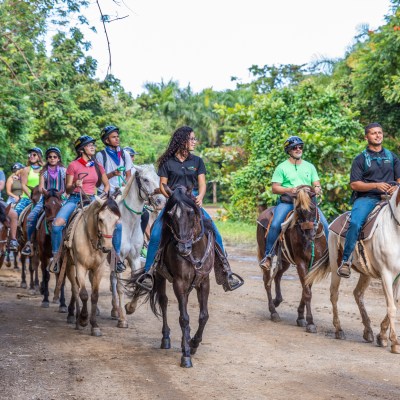 a group of people riding on the back of a horse