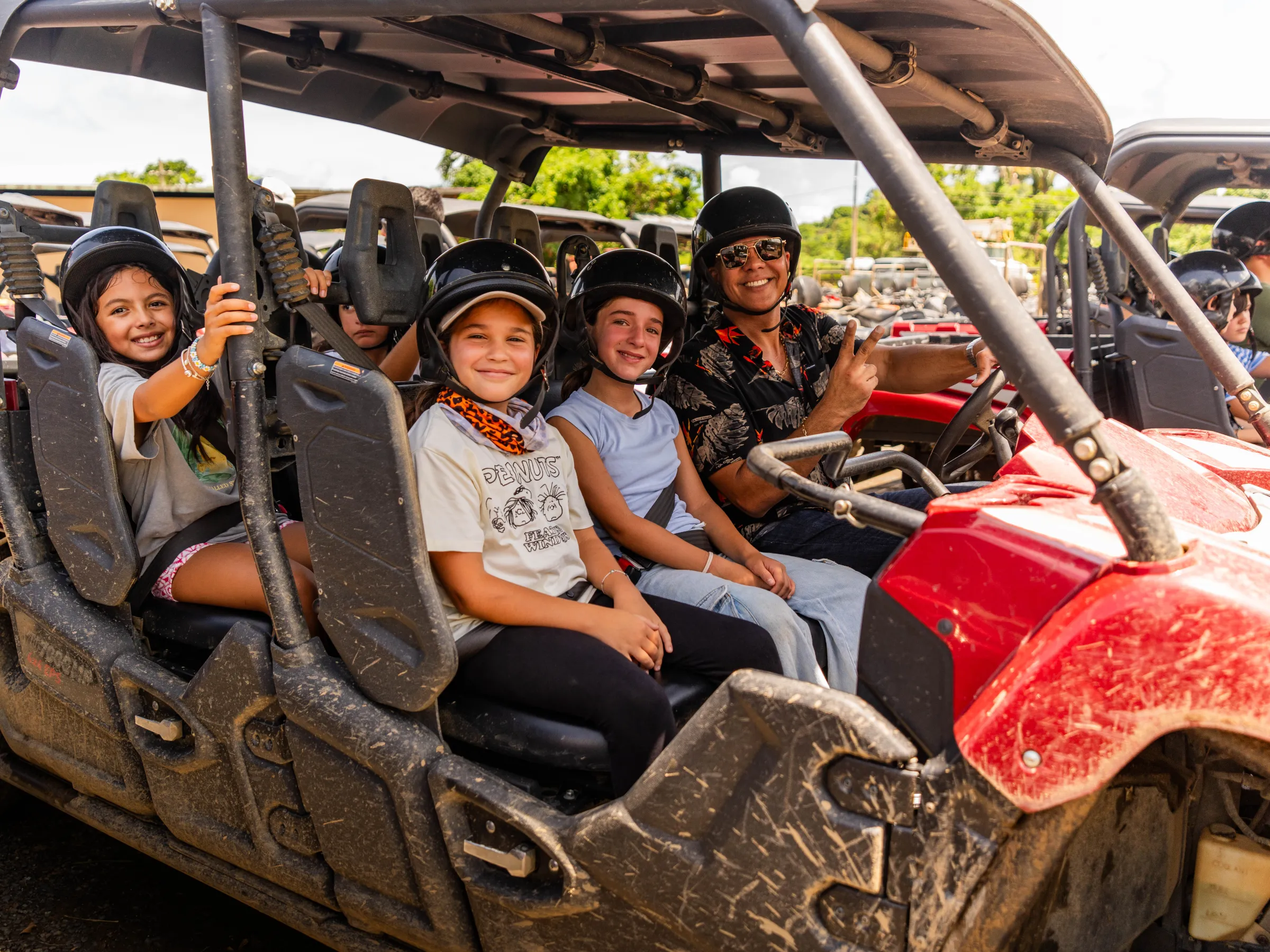 a group of people sitting on a motorcycle